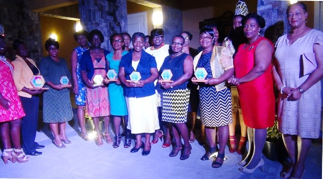 Awardees at the International Women’s Day 2016 Women of Excellence Awards Ceremony and Cocktail on at the Nevis Performing Arts Centre in Pinney's on March 12, 2016. They are accompanied by Junior Minister responsible for Social Development Hon. Hazel Brandy-Williams, Resident Judge Justice Lorraine Williams, Magistrate Yasmin Clark and Londa Brown, Coordinator of School Libraries in the Department of Education